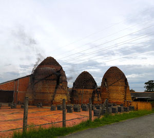 Old ruin on field against sky