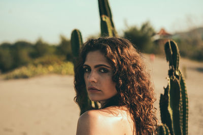 Portrait of young woman wearing hat
