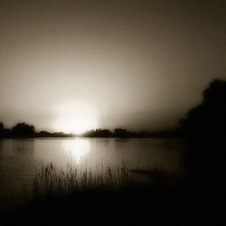 Scenic view of lake at sunset