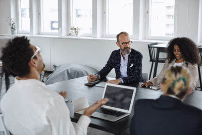 People talking at business meeting