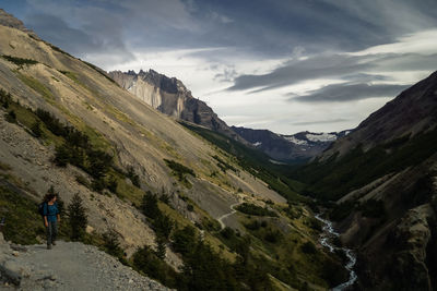 Scenic view of mountains against cloudy sky