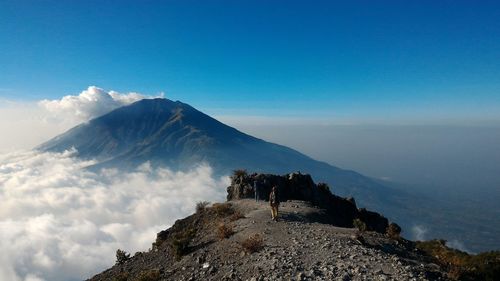 Scenic view of mountain against blue sky