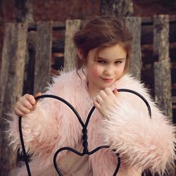 Portrait of girl wearing fur coat