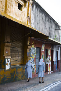 People walking on built structure