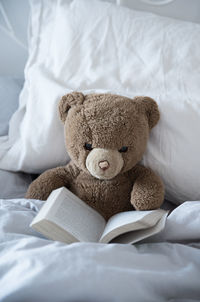 Close-up of stuffed toy on bed