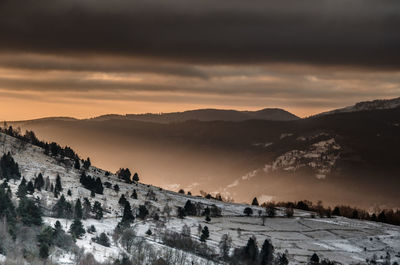 Scenic view of mountains against sky during sunset