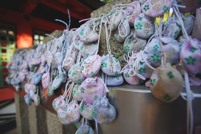 Close-up of pouches hanging on table