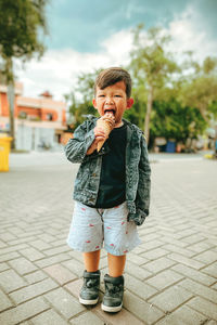 A boy who was enjoying ice cream in a park