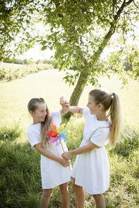 Side view of mother and daughter in park