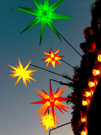 Low angle view of christmas tree against clear sky