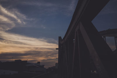 Low angle view of building against cloudy sky