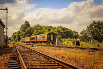 Train on railway tracks against sky