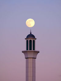 Low angle view of tower against sky during sunset