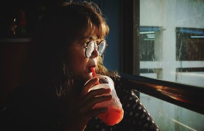 Portrait of man drinking water from glass