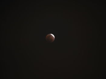 Low angle view of moon against sky at night