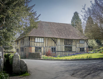 Building by road against clear sky