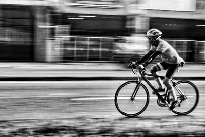 Man riding bicycle on street