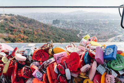 Close-up of padlocks hanging on railing