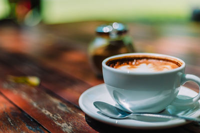 Close-up of coffee cup on table