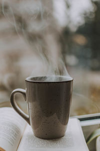 Close-up of coffee cup on table