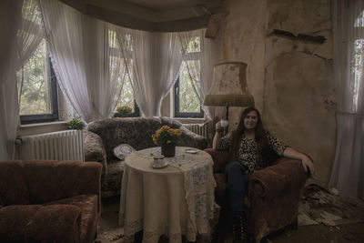 Woman and interior of abandoned room