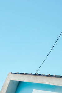 Low angle view of building against clear blue sky