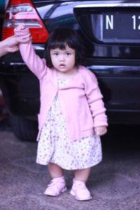 Portrait of cute girl standing on bus