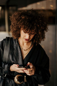 Young woman using mobile phone