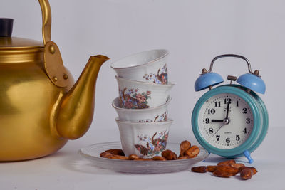 Close-up of clock on table