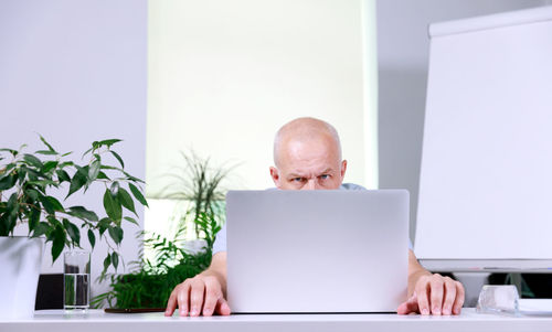 Woman using laptop at table