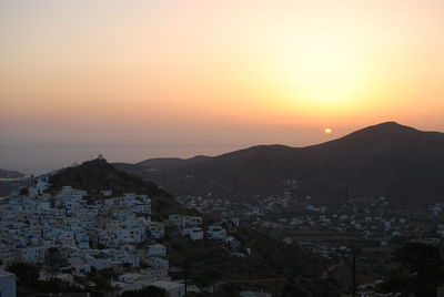 High angle view of cityscape against sky at sunset