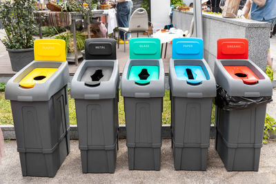 Multi colored dustbin outdoors