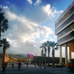 City street against cloudy sky