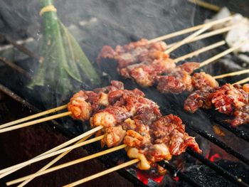 Close-up of meat on barbecue grill