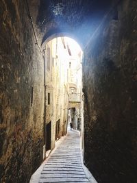 Narrow alley along old buildings