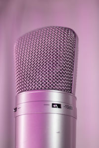 Macro shot of electric fan against colored background