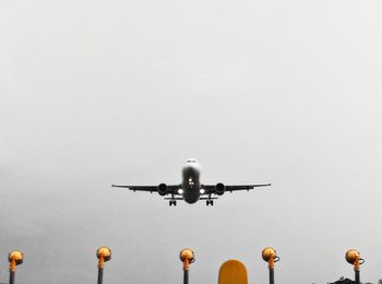 Low angle view of airplane flying in sky