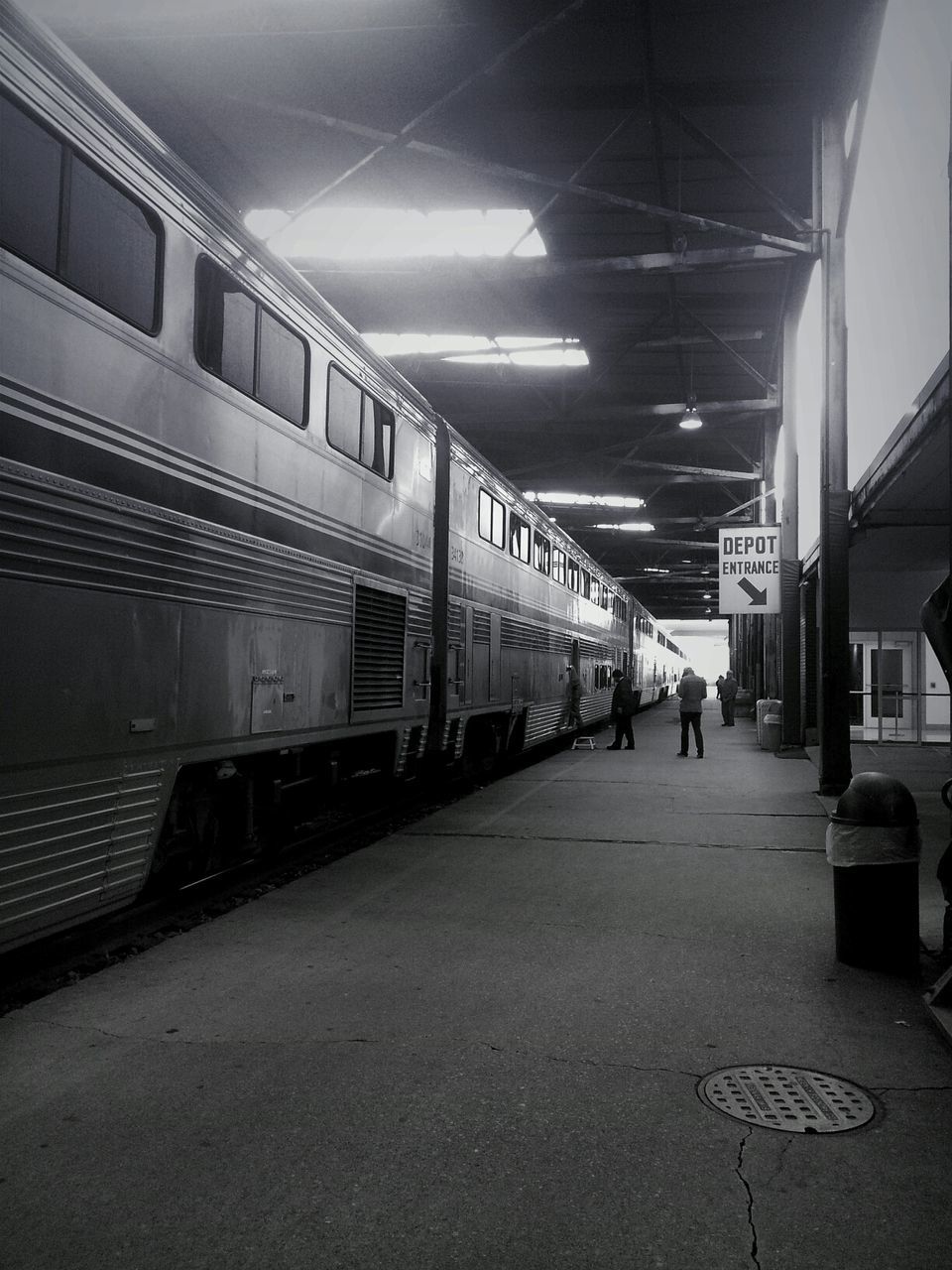 transportation, indoors, public transportation, railroad station, railroad station platform, rail transportation, illuminated, the way forward, railroad track, mode of transport, architecture, subway, diminishing perspective, train - vehicle, ceiling, subway station, built structure, travel, incidental people, empty