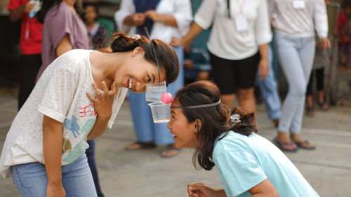 Side view of two people
