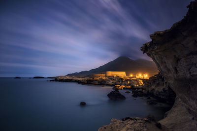 Scenic view of sea against sky at night