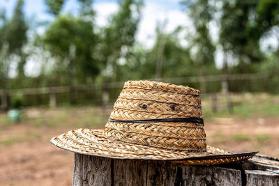 Close-up of rope on wooden table in field