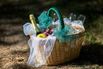 Close-up of piknic basket on field
