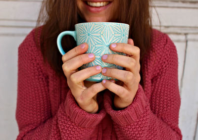 Close-up portrait of woman holding ice cream