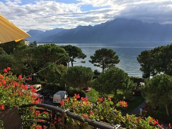 Scenic view of lake and mountains against sky