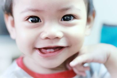 Close-up portrait of smiling cute baby girl