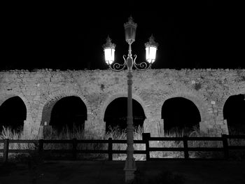 Low angle view of illuminated street light at night