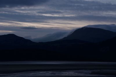 Scenic view of mountains against sky during sunset