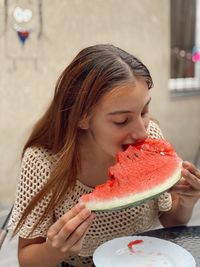 Woman eating watermelon