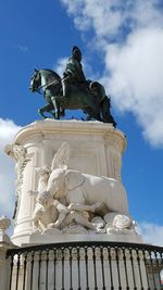 Low angle view of statue against sky