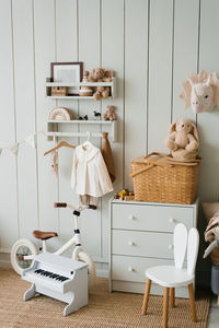 Cozy interior of a children's room, a play area. toys, a bicycle, a piano, a chest of drawers